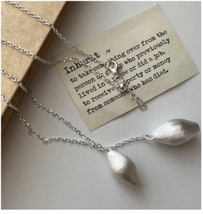 Close-up of S925 sterling silver water drop pendant with brushed matte texture finish
