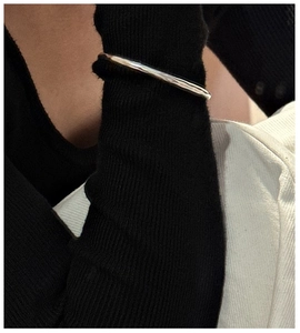 Macro detail of S925 silver cuff bracelet with vintage matte lava texture on wrist