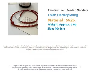 Detail view of red agate beaded necklace with S925 sterling silver lobster clasp and chain