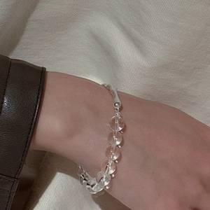 Minimalist S925 sterling silver bracelet with clear white crystal beads on a female wrist