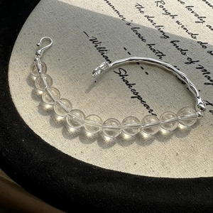S925 sterling silver bracelet with clear crystal beads and wave-shaped metal bar