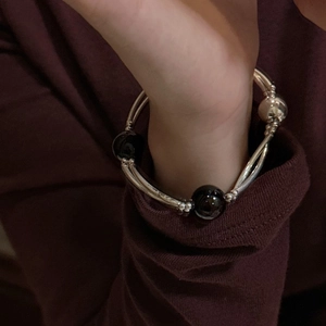 Elegant S925 sterling silver double-layer bracelet with black agate beads on wrist