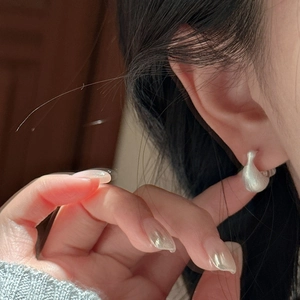 Minimalist S925 sterling silver earrings with a matte textured curved streamline design