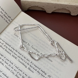 S925 sterling silver knotted toggle clasp bracelet with hammered texture on vintage book