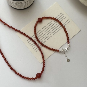 S925 sterling silver red agate beaded bracelet with lobster clasp on white background