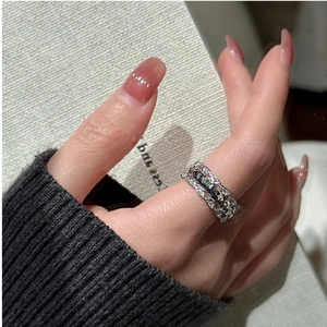 Detailed view of s925 silver wide band ring with black and white zircon pavé setting