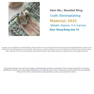 Macro detail of S925 sterling silver beaded ring with green and blue stones