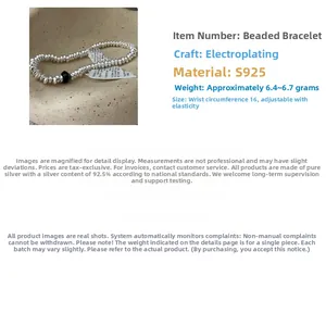 Detailed view of S925 sterling silver beaded stretch bracelet with a black accent bead