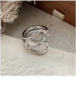 Detailed close-up of S925 sterling silver multi-layer wavy ring with vintage texture