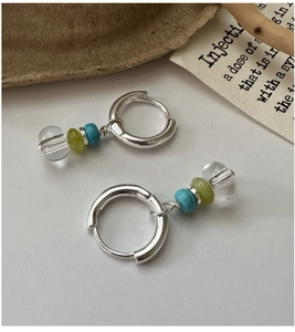 Detailed shot of S925 silver hoop earrings with blue, green, and clear crystal beads