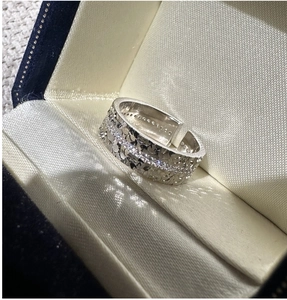 Detailed macro view of S925 sterling silver ring with hammer texture and cubic zirconia