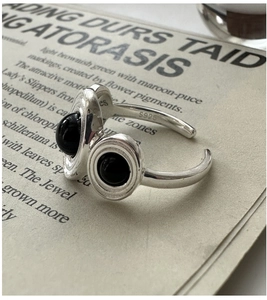 Detail of S925 sterling silver ring with dual black onyx and visible S925 hallmark