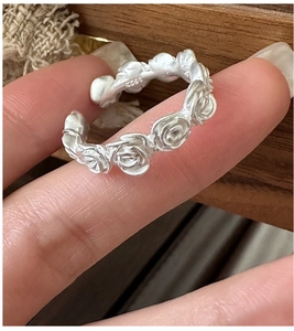 Close-up of S925 sterling silver stamp on the matte vintage rose flower ring inner band