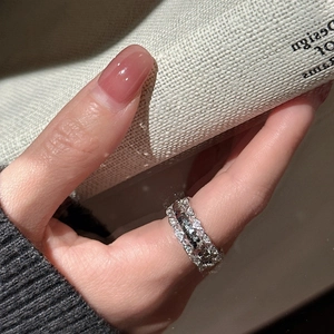 S925 sterling silver crushed ice ring with pavé zircons on finger in close-up shot