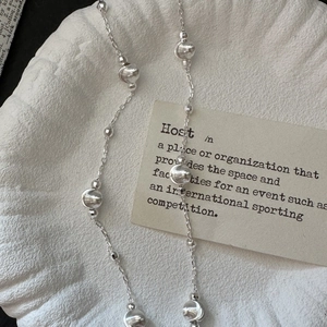 Minimalist S925 sterling silver beaded choker necklace on white textured background