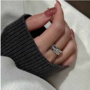 Detailed view of S925 sterling silver wide band ring with crushed ice texture and zircons