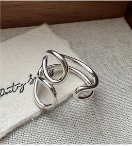 Macro detail of S925 sterling silver multilayer ring with minimalist geometric lines