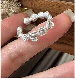 Detailed macro of vintage matte S925 sterling silver rose flower adjustable open ring