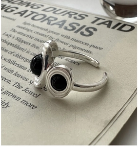 Detail of S925 sterling silver ring showing the S925 hallmark and black onyx stones