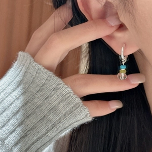 S925 sterling silver hoop earrings with three colorful crystal beads on female model
