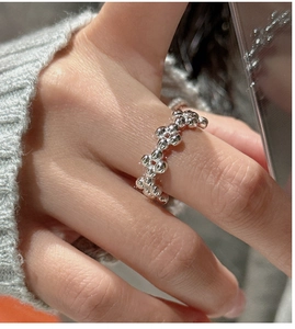 Close-up of S925 silver ring featuring unique irregular bubble texture on finger