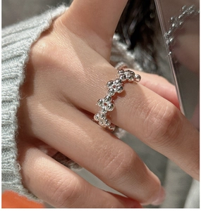 Detailed close-up of S925 sterling silver bubble textured ring with liquid metal finish