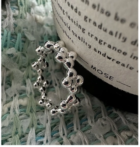 Macro view of S925 sterling silver ring featuring polished bubble bead textures