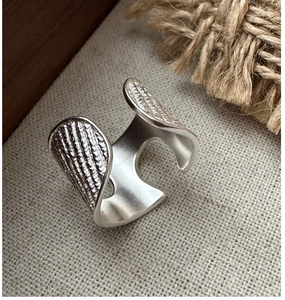 Macro detail of S925 sterling silver ring featuring vintage vertical textures and matte finish