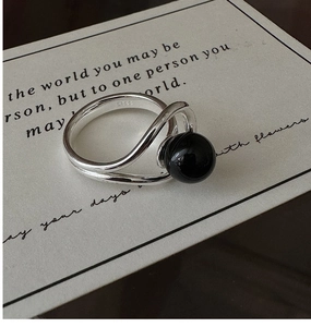 Detailed view of S925 sterling silver ring with black agate bead and S925 hallmark
