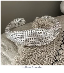 Detail of S925 sterling silver hollow mesh cuff bracelet with a minimalist C-shape design
