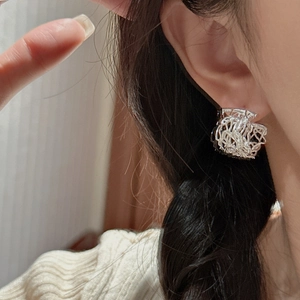 Minimalist S925 sterling silver irregular twisted hoop earrings with artistic texture