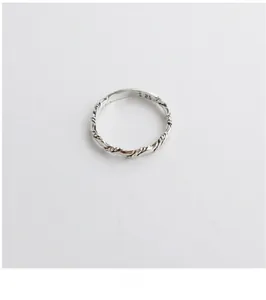 Close-up of S925 sterling silver ring with twisted rope texture and purity stamp