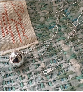 Detailed close-up of S925 sterling silver beaded necklace with engraved heart ball pendant