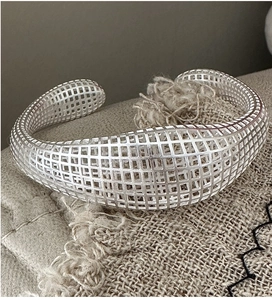 Detail of S925 sterling silver hollow mesh wide cuff bracelet with geometric grid pattern
