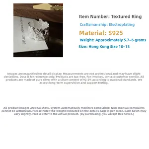 Macro detail of S925 sterling silver ring with irregular hammered texture and plating