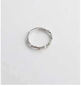Macro shot of S925 sterling silver stamp on the twisted rope band vintage ring