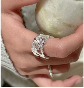 Detailed shot of an S925 silver ring featuring lava texture and heart cutout design