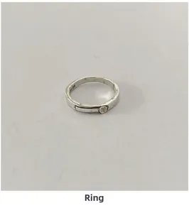 Detail view of S925 sterling silver ring with vintage texture and small zircon stone