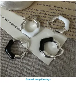 Detailed view of S925 silver wave hoop earrings with black and white enamel glaze finish