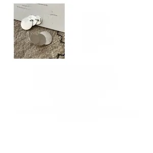 Detailed view of S925 sterling silver round earrings with a textured brushed finish