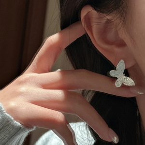 Elegant S925 sterling silver butterfly earrings featuring intricate textured wing details
