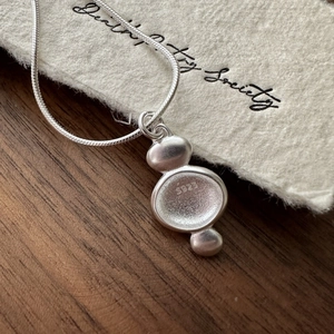 Minimalist S925 sterling silver necklace with matte organic pendant and snake chain