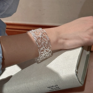 Artistic 925 sterling silver hollow woven bracelet with minimalist irregular line design