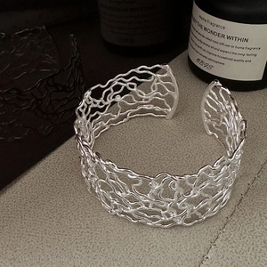 Modern 925 sterling silver cuff bracelet featuring hollow organic line design and a glossy finish