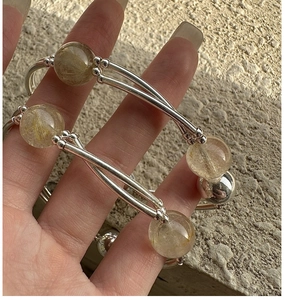 Detailed close-up of S925 silver bracelet featuring natural golden rutilated quartz gemstone