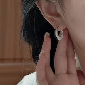 Minimalist S925 sterling silver geometric earring with white enamel finish on model
