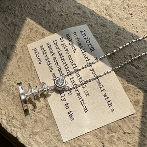 S925 sterling silver fountain pendant necklace with tiered wave discs on stone surface