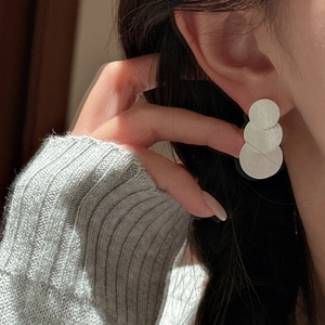 Modern S925 sterling silver layered triple disc earrings with a brushed metallic texture