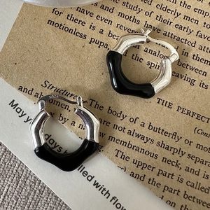 Minimalist S925 sterling silver hoop earrings with irregular wave design and black enamel