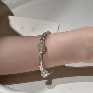 Minimalist S925 sterling silver rutilated quartz stretch bracelet on woman wrist